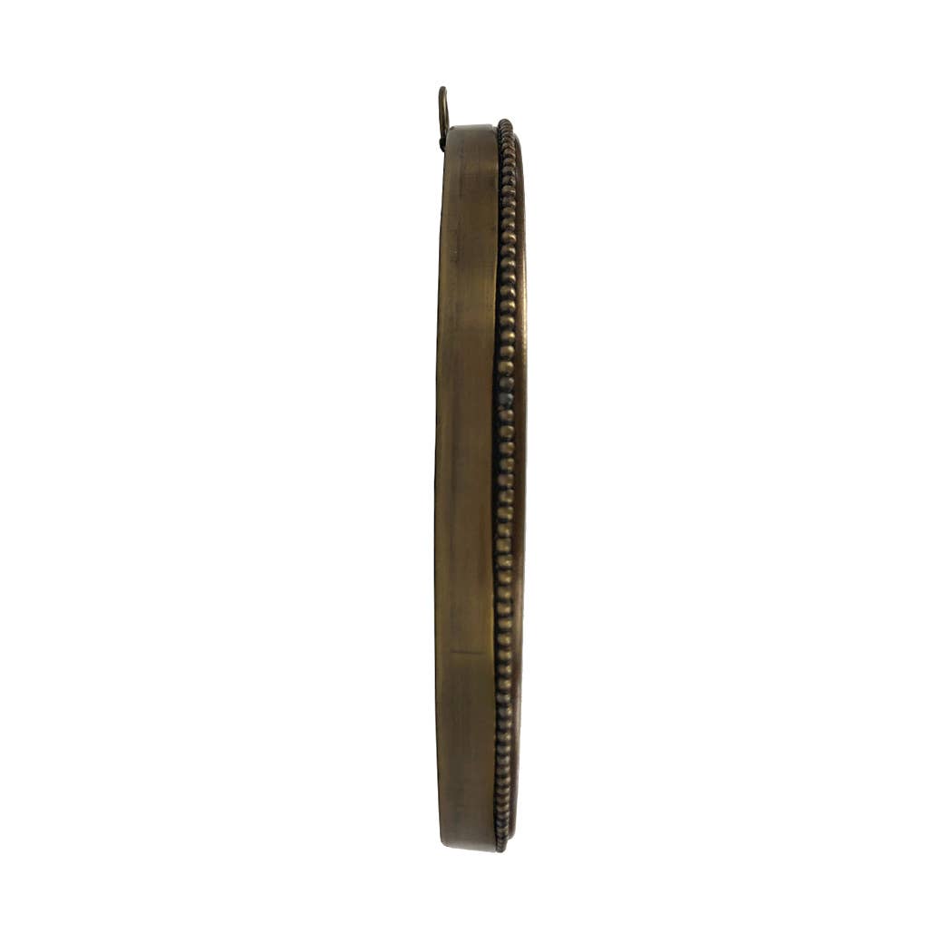 A side-angle view of the framed artwork, highlighting its slim yet sturdy brass construction.
