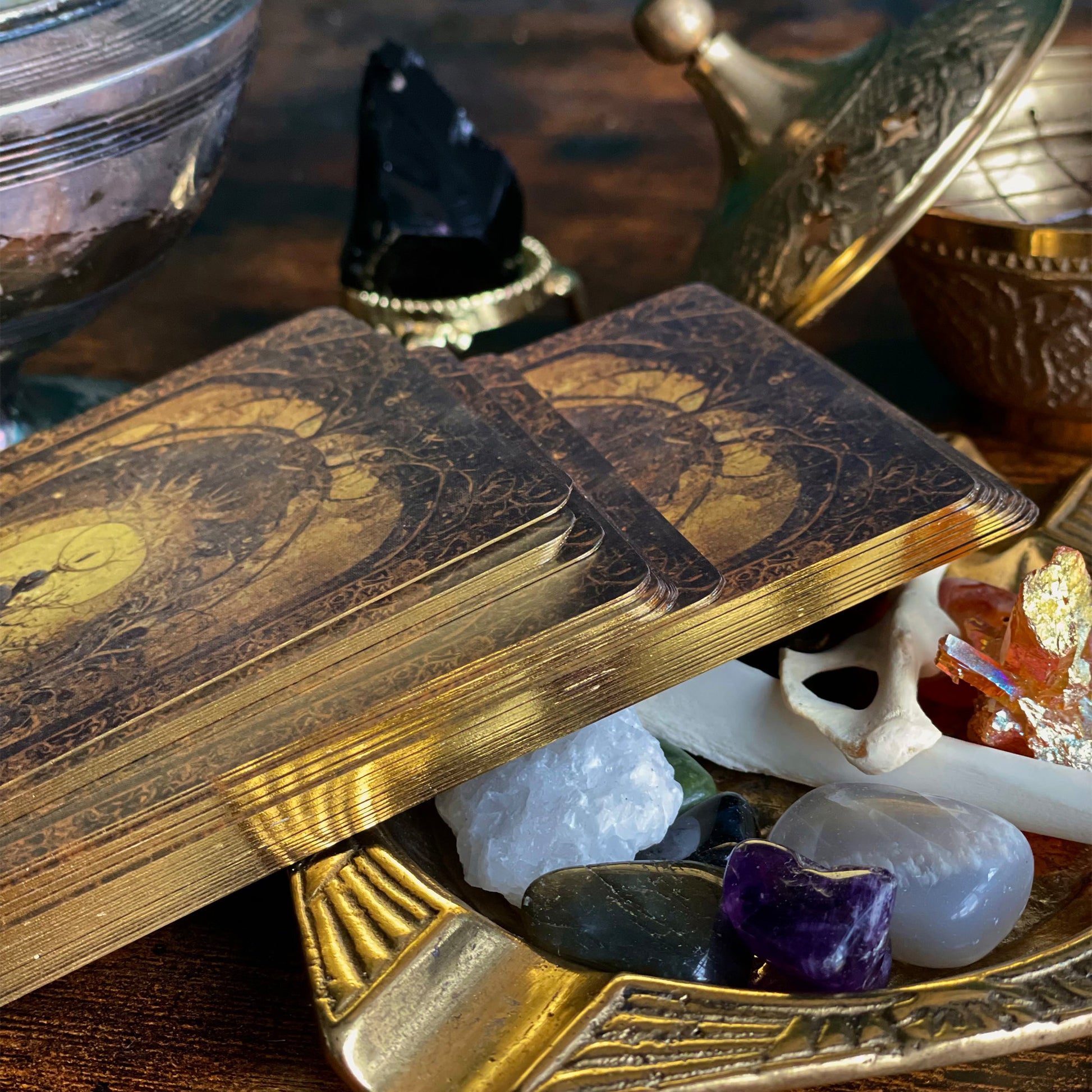 Close-up of the Shadow Work Tarot Deck's gold-edged cards, showcasing the luxurious and antique-inspired gilding that adds an elegant touch to the Victorian-era aesthetic.