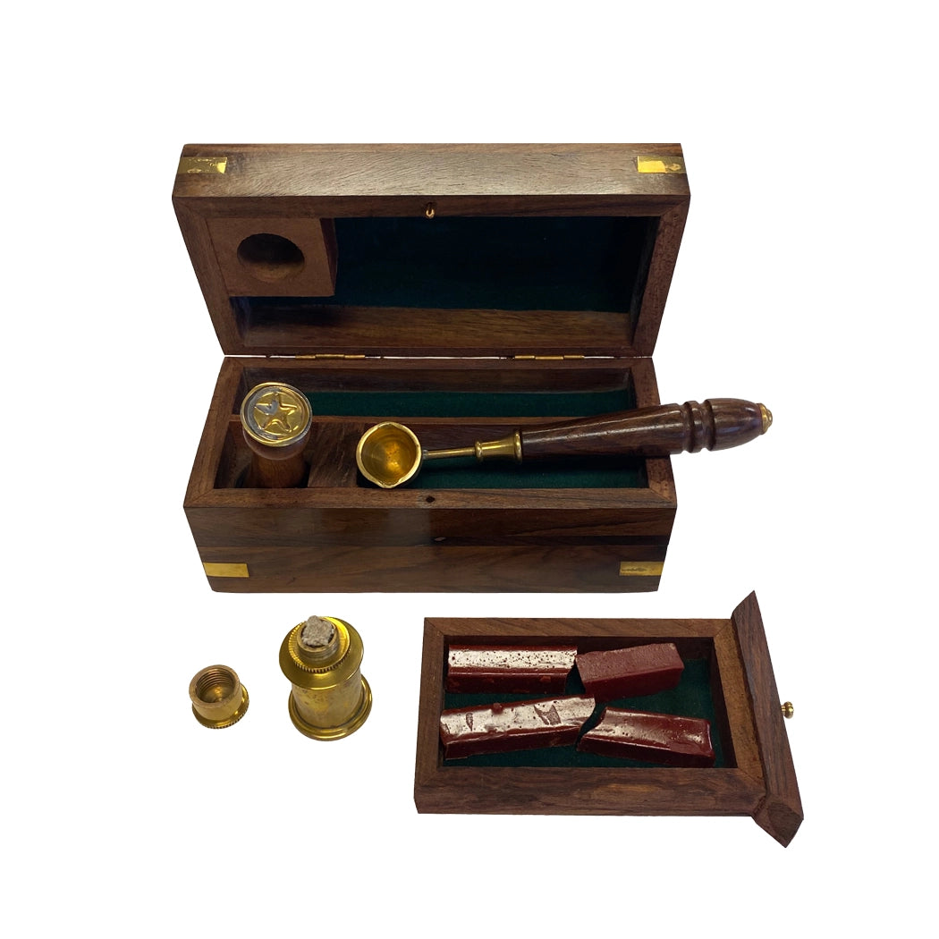 Wooden box with a brass telescope and other items on a white background