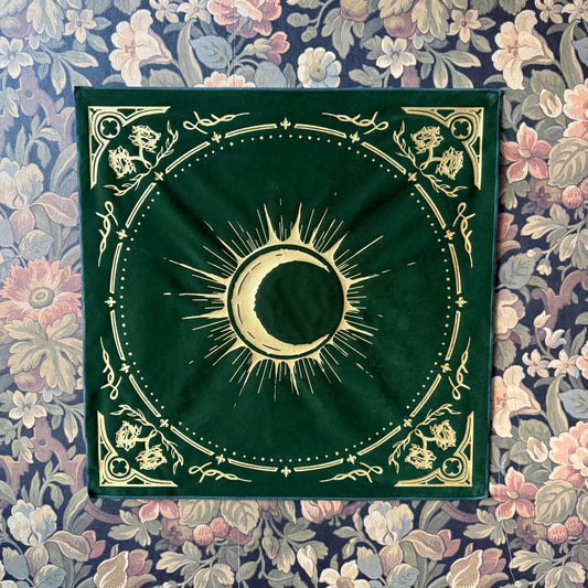 The Eclipsa Altar Cloth in Emerald, featuring rich velvet fabric and a gold foil eclipse emblem, inspired by Victorian elegance.