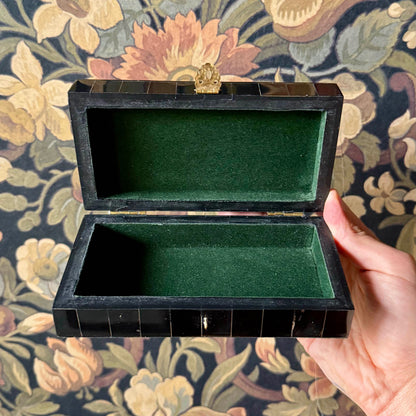 The black horn box opened to reveal a green felt-lined interior, ideal for storing jewelry, keepsakes, or tarot cards.