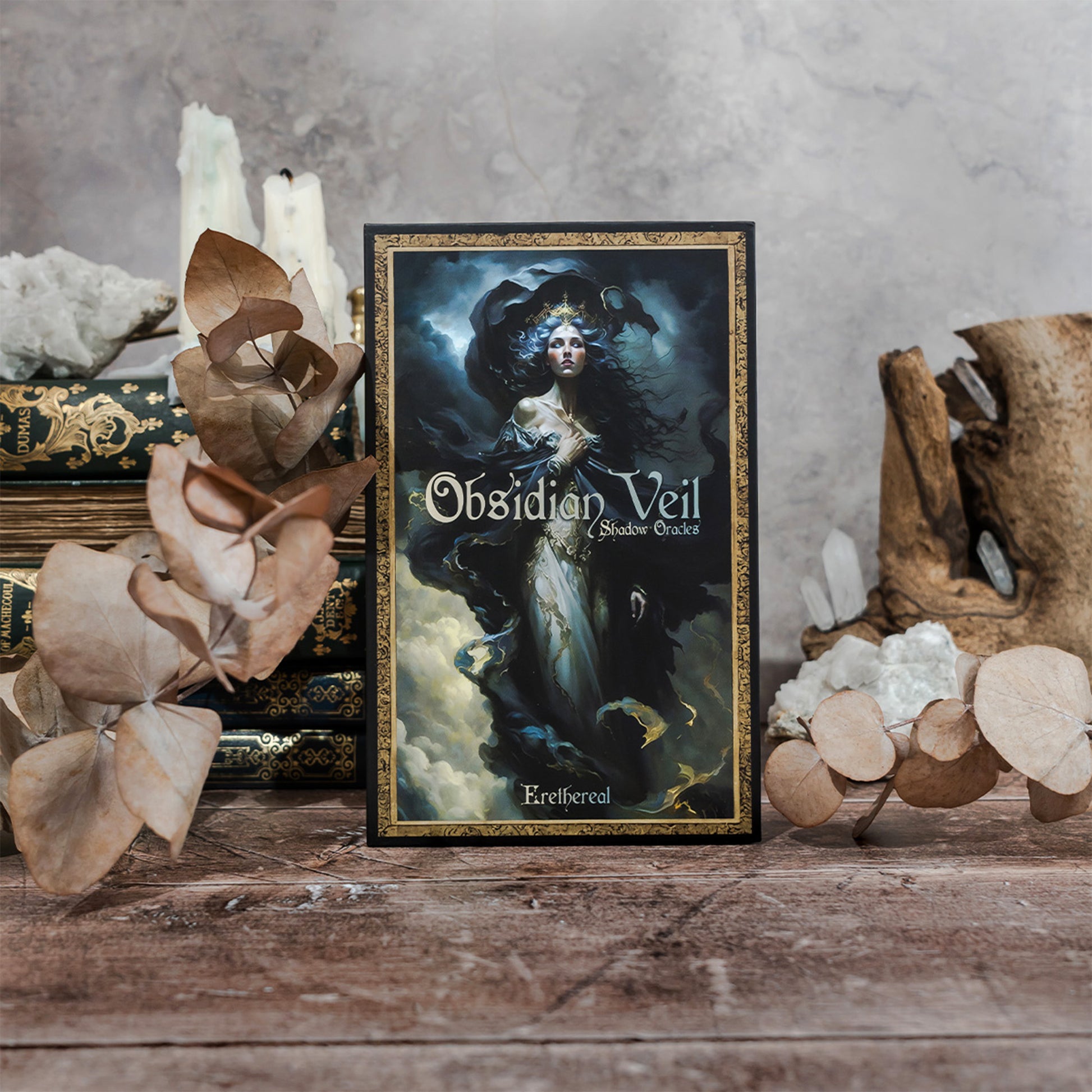 Photo of a selection of cards from the Obsidian Veil Oracle Deck scattered across a surface, highlighting the deck's diverse and captivating illustrations, each imbued with deep spiritual symbolism.