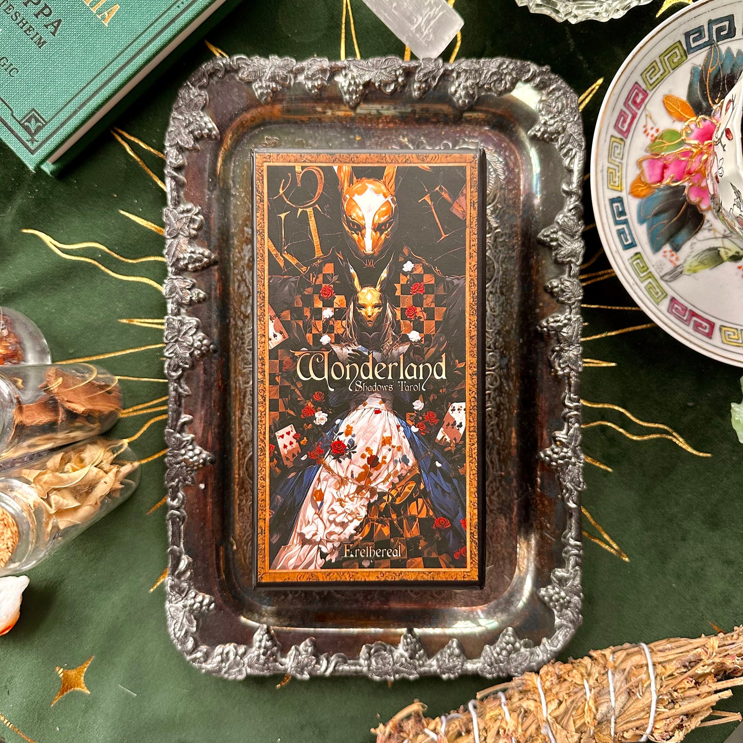 The Wonderland Shadows Tarot Deck box with its cover art displayed. The artwork includes intricate Wonderland-inspired designs with vibrant colors and mystical motifs, perfectly capturing the deck’s whimsical and shadowy themes.