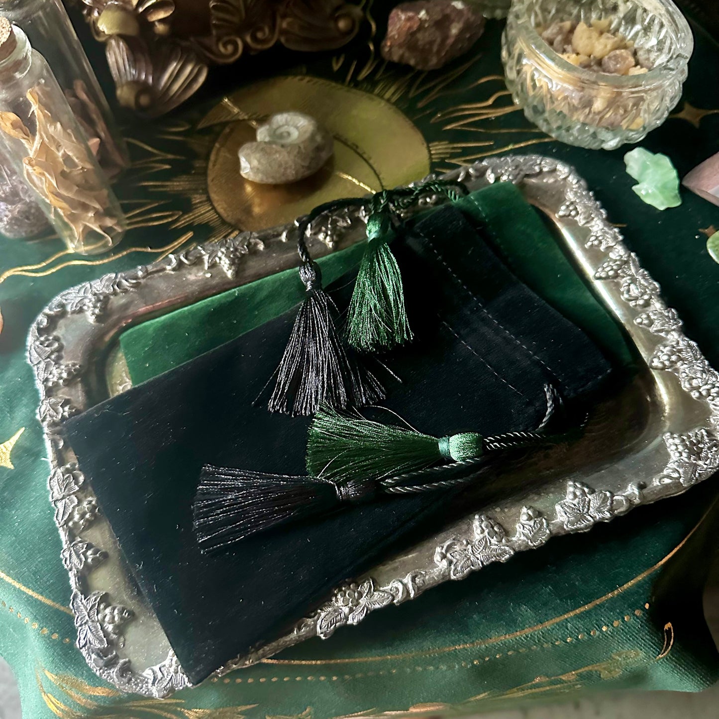 An image showcasing both the emerald green and black velvet pouches side by side, highlighting their contrasting colors and refined design, perfect for spiritual and everyday use.