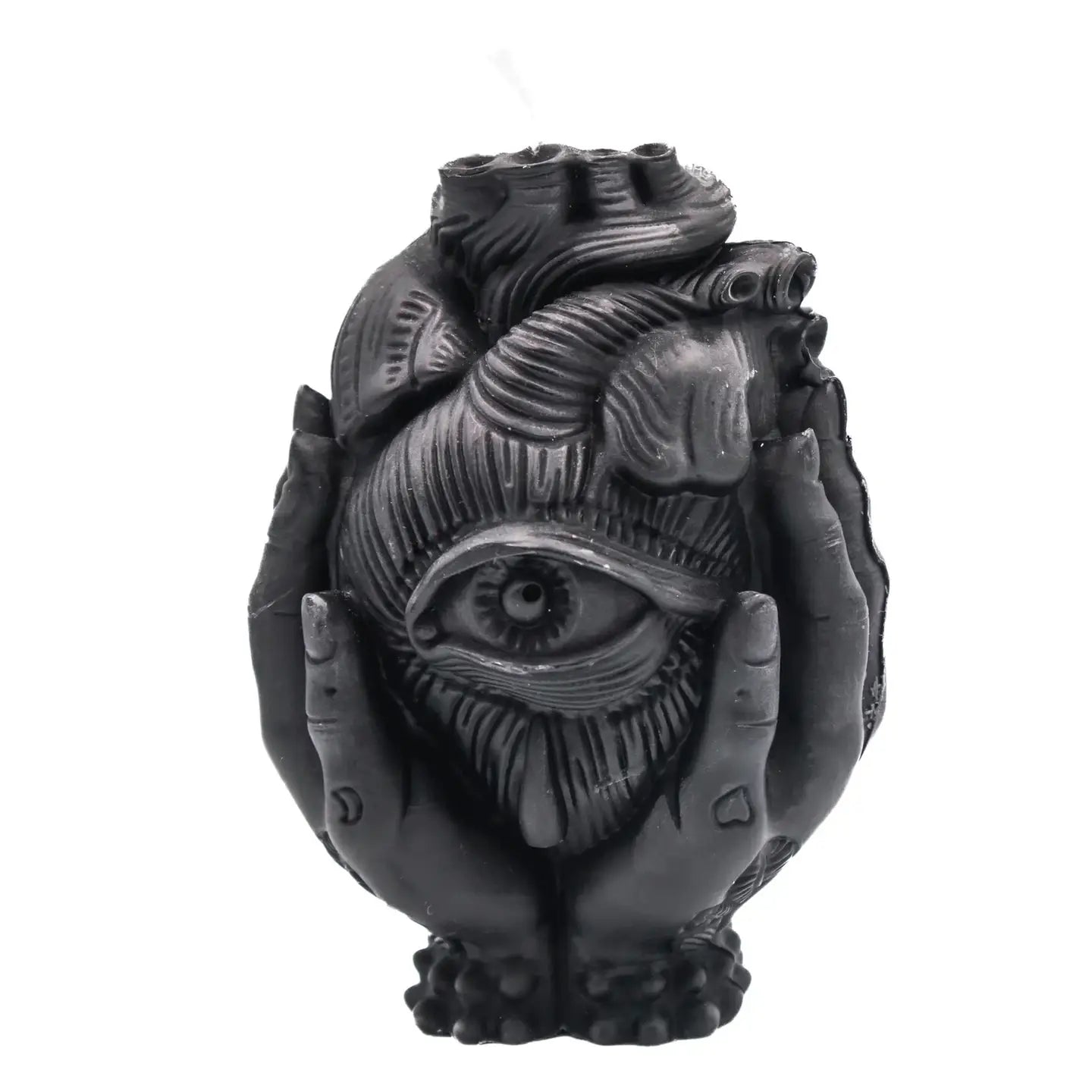 A black gothic-style sculpture of an anatomical heart held in two hands, featuring a prominent all-seeing eye on the front, set against a plain white background.